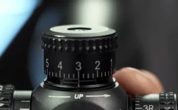 How do I adjust the elevation on a rifle scope?