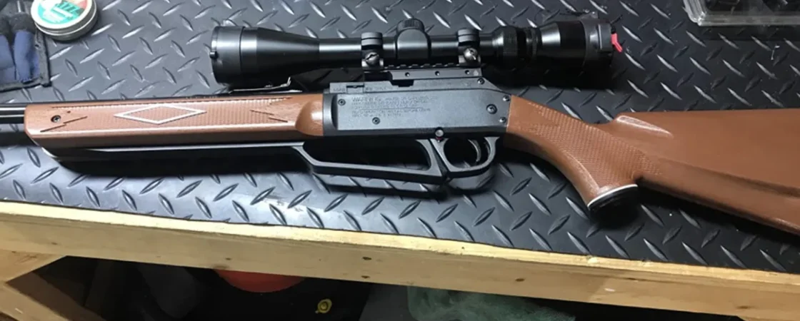 How do I remove a rifle scope?