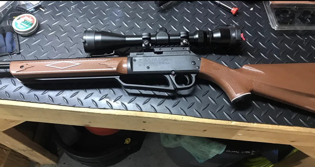 How do I remove a rifle scope?